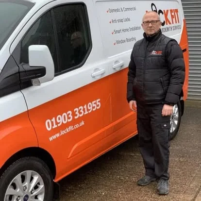 Sean Woodard beside the LockFit Worthing van